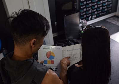 andy and claudia reviewing exercise plan at lux fit