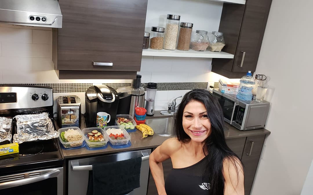 meal prep at home kitchen with fit female personal trainer